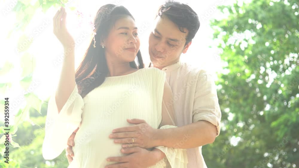Happy Family couple a man with a pregnant woman in nature is waiting for the replenishment of the family. Happy Family couple a man with a pregnant woman in nature is waiting for the replenishment of the family.