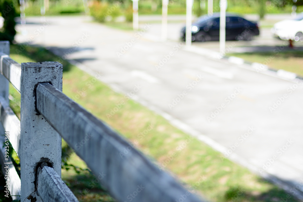 White rail fence leading along the road in drive training center. White rail fence leading along the road in drive training center.