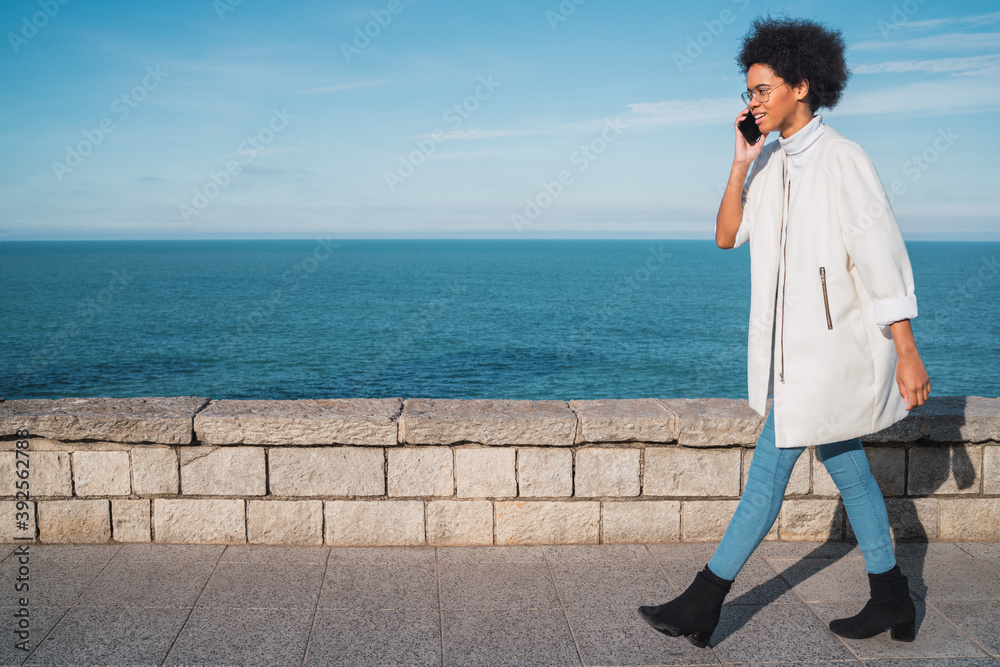Latin woman talking on the phone. Latin woman talking on the phone.