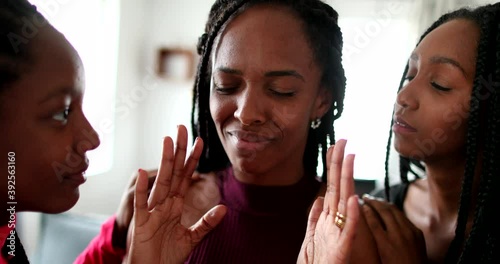 African teenage daughters wanting mother attention, stressed black parent