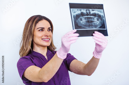 Dentist checking tooth x-ray for oral tratment in Mexico photo