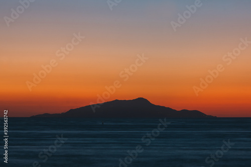 Sunset behind Ischia Island with Slhouette, an Orange and Teal or Blue Abstract Background © Dietmar