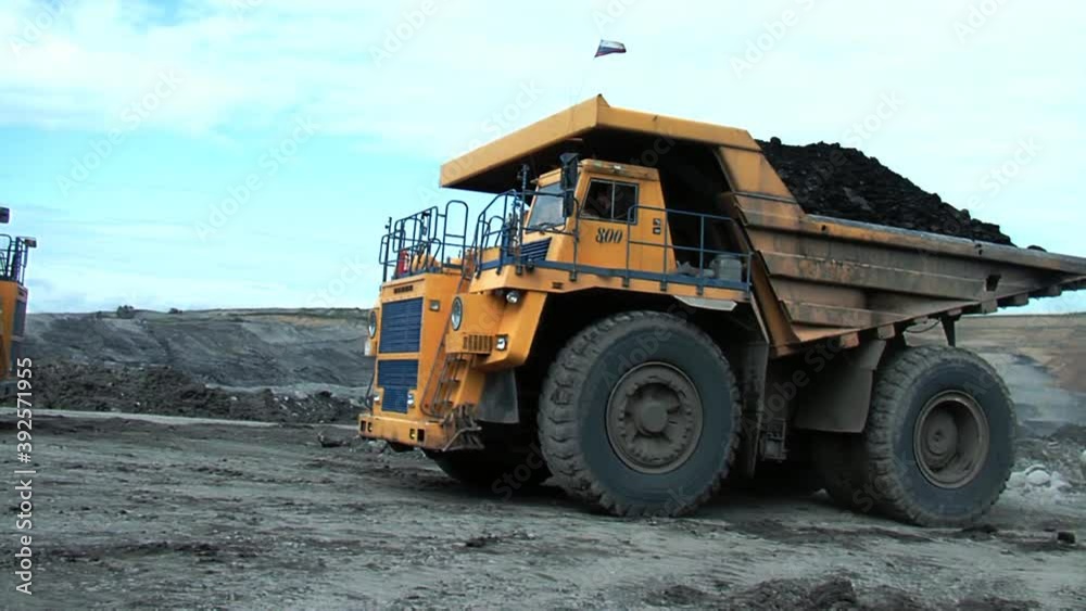 A large multi-ton truck with coal A large multi-ton truck with coal