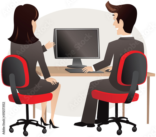 Man and woman sitting at PC
