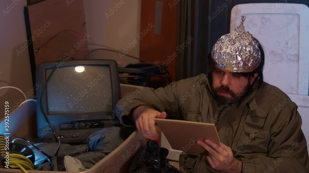 Crazy man reading paper document