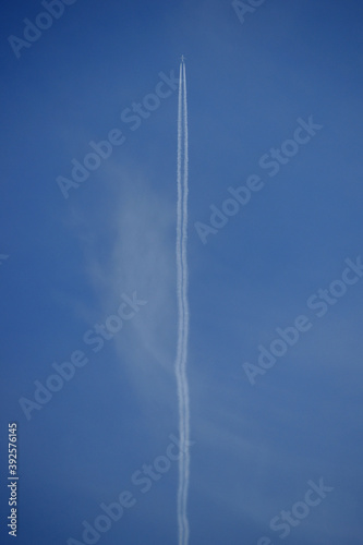 airplane with condensation trail