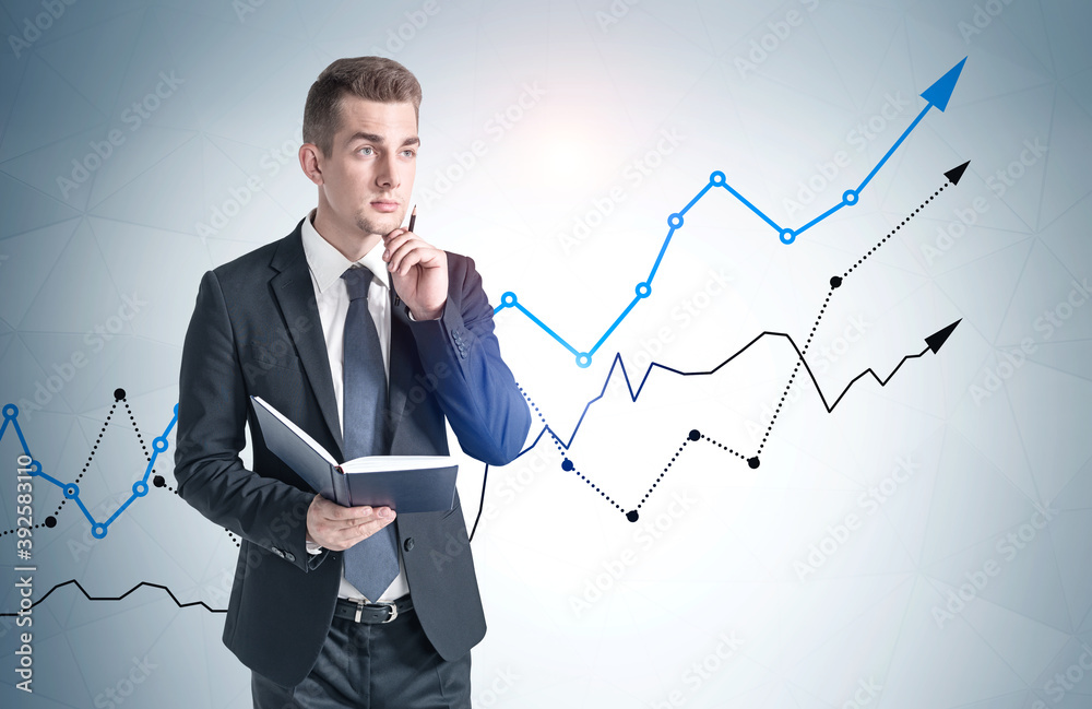 Man with book and growing graph Man with book and growing graph