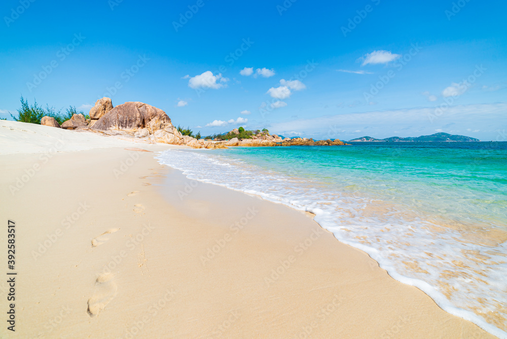 Gorgeous tropical beach turquoise transparent water unique rock boulders, Cam Ranh Nha Trang Vietnam south east coast travel destination, desert beach no people clear blue sky Gorgeous tropical beach turquoise transparent water unique rock boulders, Cam Ranh Nha Trang Vietnam south east coast travel destination, desert beach no people clear blue sky