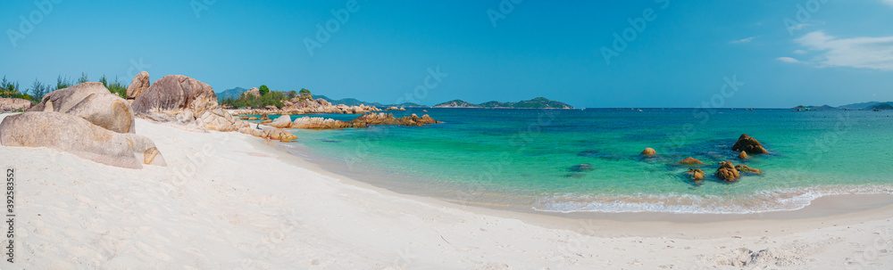 Gorgeous tropical beach turquoise transparent water unique rock boulders, Cam Ranh Nha Trang Vietnam south east coast travel destination, desert beach no people clear blue sky