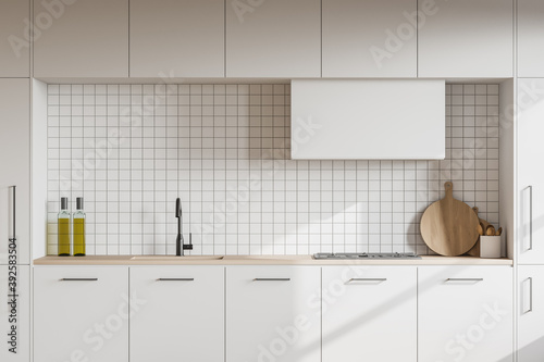 White kitchen interior with cupboards, close up