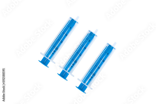 Set with different syringes on white background.