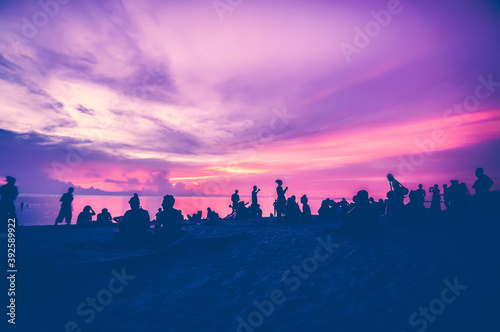 Silhouettes of people on the shore at sunset, Andaman Sea, Koh Phangan, Thailand
