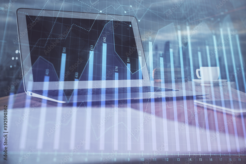Forex Chart hologram on table with computer background. Double exposure. Concept of financial markets. Forex Chart hologram on table with computer background. Double exposure. Concept of financial markets.