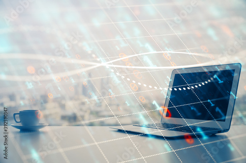 Forex graph hologram on table with computer background. Multi exposure. Concept of financial markets.