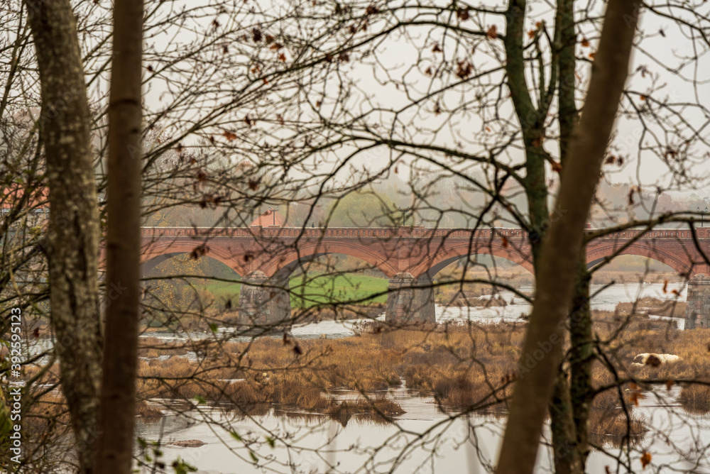 old brick bridge in autumn old brick bridge in autumn