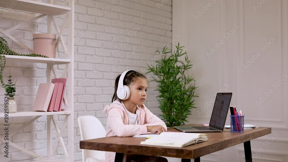 little child girl using laptop computer for studying online e-learning system. online education concept little child girl using laptop computer for studying online e-learning system. online education concept
