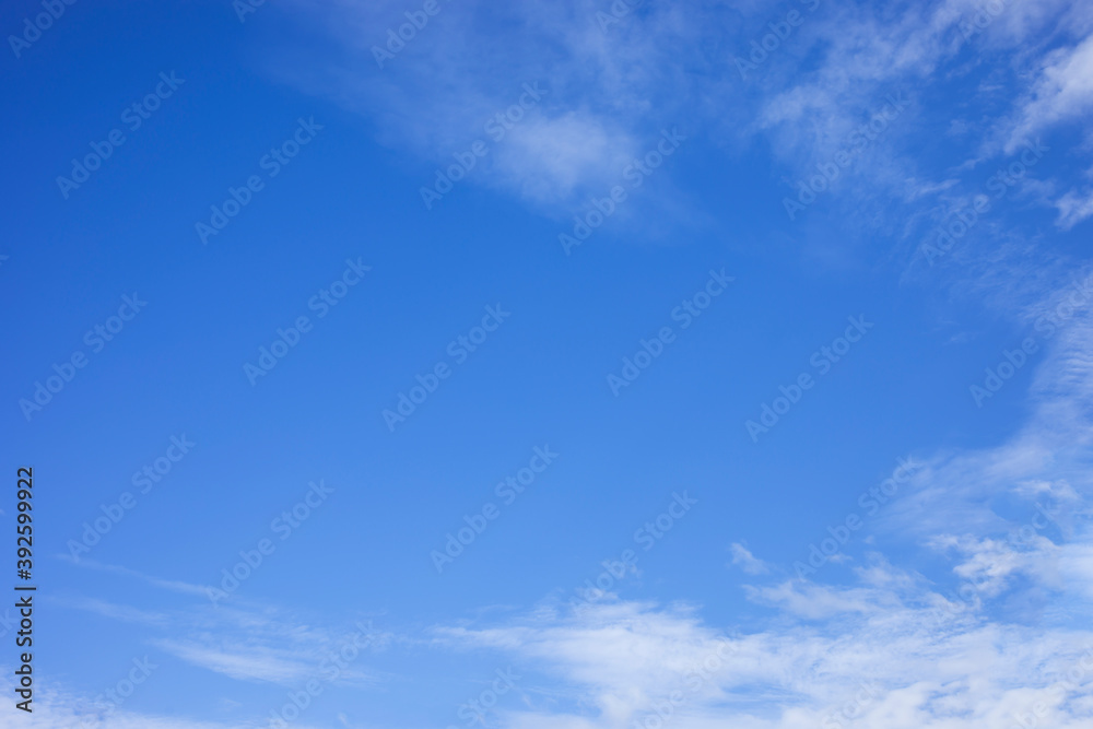 Blue sky background and white clouds soft focus, and copy space