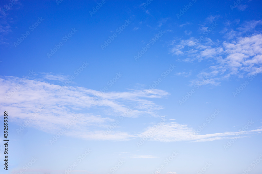 Blue sky background and white clouds soft focus, and copy space