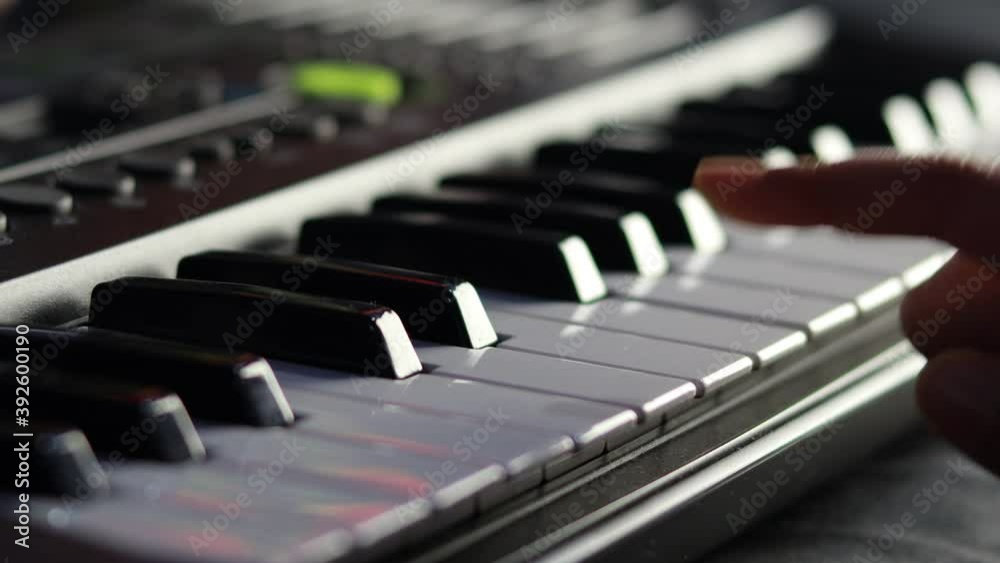 Selective focus of playing piano or keyboard with human hand Selective focus of playing piano or keyboard with human hand
