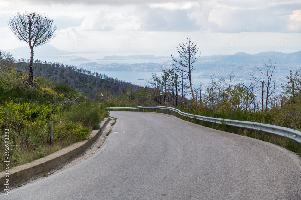 Fototapeta premium The road to the volcano mount Vesuvius and panoramic view of Naples city Italy