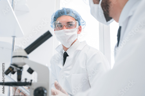 group of scientists discussing the results of testing.