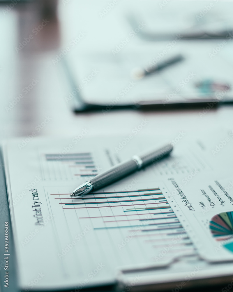 close up. financial chart and pen on the desktop. close up. financial chart and pen on the desktop.