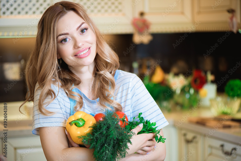 Healthy eating lifestyle concept portrait of beautiful young woman with vegetables in her hand at home in the kitchen Healthy eating lifestyle concept portrait of beautiful young woman with vegetables in her hand at home in the kitchen