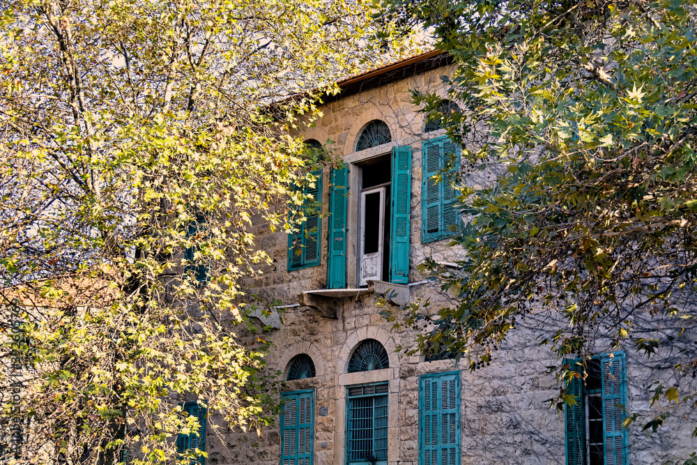 A vintage house built with stone during fall season