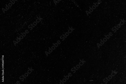 Black abstract background. White dots on a black background.