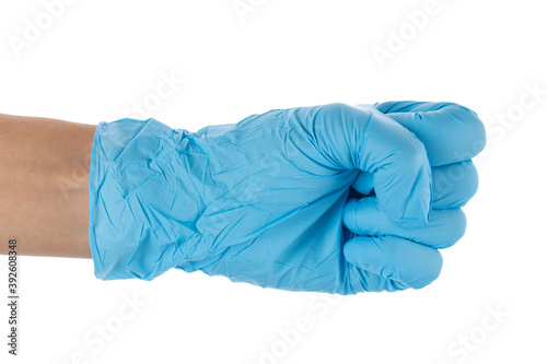 Hand wearing blue glove to protect herself from COVID-19, isolated on white background.