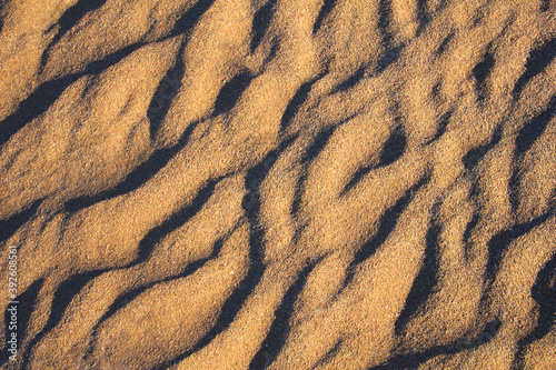 Beautiful nature background - Rippled sand at sunset time in Maranjab desert near Kashan, Iran, Middle East