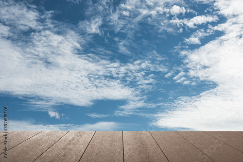 Blue sky with plank floor