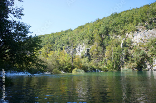 The water surface of Plitvice Lakes  in which fish are reflected
