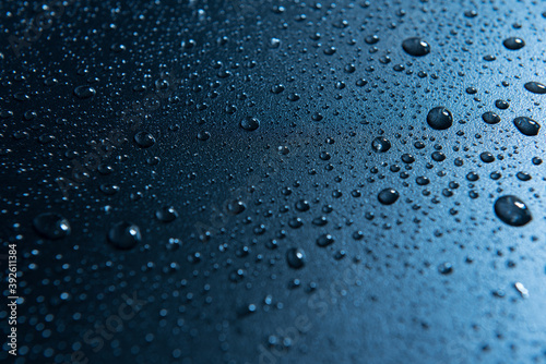 Water drop on glass, out of focus