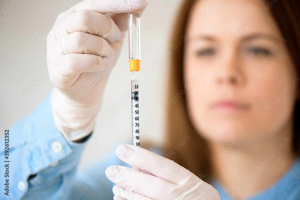 A girl fills a syringe for insulin injections. Diabetes. The short-acting insulin. Insulin injection at home. A girl fills a syringe for insulin injections. Diabetes. The short-acting insulin. Insulin injection at home.