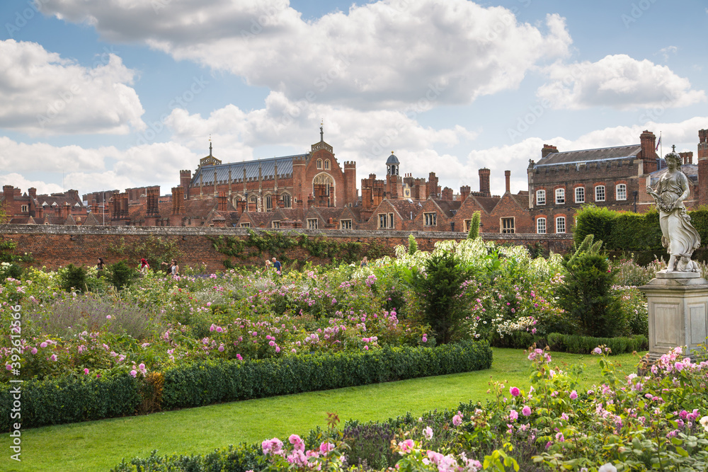 London, UK - July 29, 2019: English garden view and the East Front of Hampton court 17th century locates West London