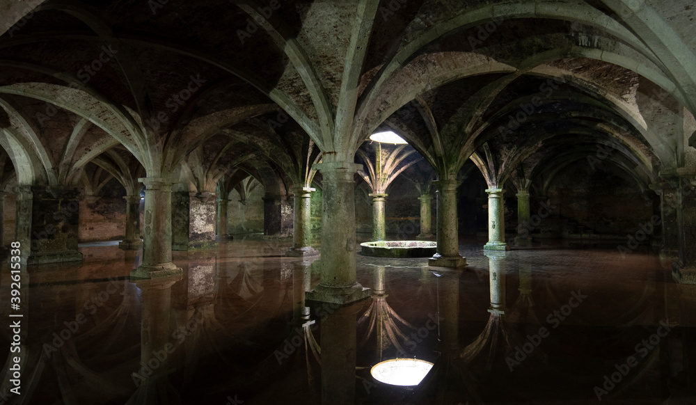 EL JADIDA, MOROCCO. The old Manueline Cistern with reflection. Sunlight beam in darkness, dark room on ground floor in Portuguese Cisterns. EL JADIDA, MOROCCO. The old Manueline Cistern with reflection. Sunlight beam in darkness, dark room on ground floor in Portuguese Cisterns.