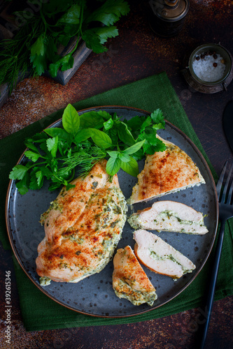 Baked chicken breast stuffed with cream cheese and spinach, selective focus