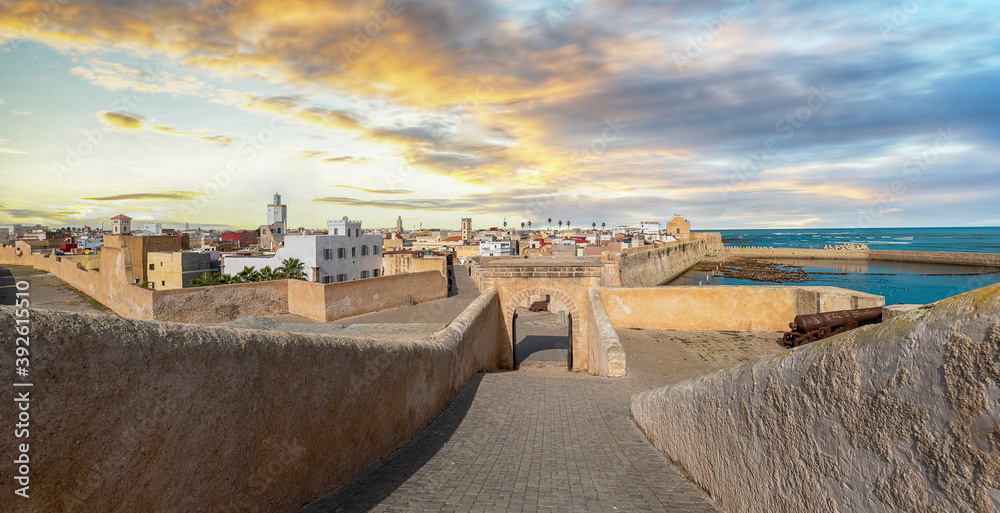 Panoramic view of Mazagan in El Jadida, Morocco at sunset. The City Wall around  the old city. It is a Portuguese Fortified Port City registered as a UNESCO World Heritage Site. Panorama. - obrazy, fototapety, plakaty 