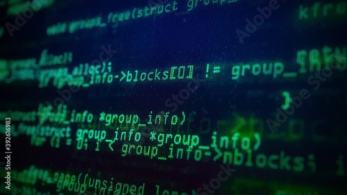 Close-up of Green Program Code on a Computer Screen in Defocus. Software development and hacking concept. Technology, coding, programming