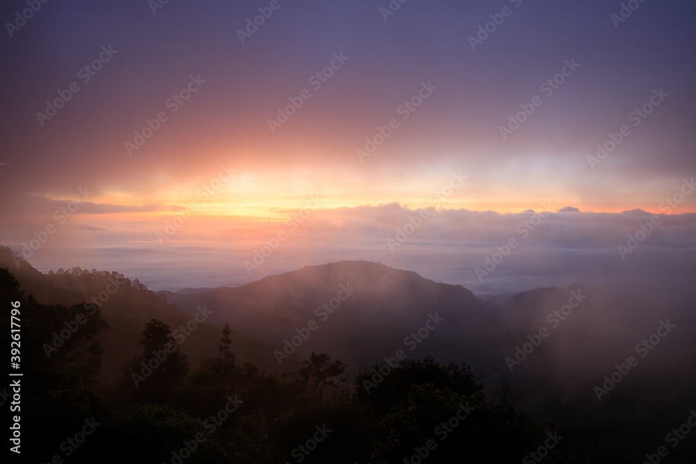 Landscape mountain silhouette with overcast at sunrise