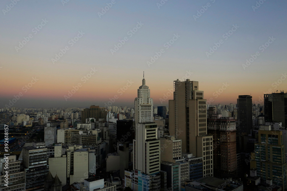 A thick layer of pollution is seen in the horizon during sunset in downtown Sao Paulo, Brazil.
