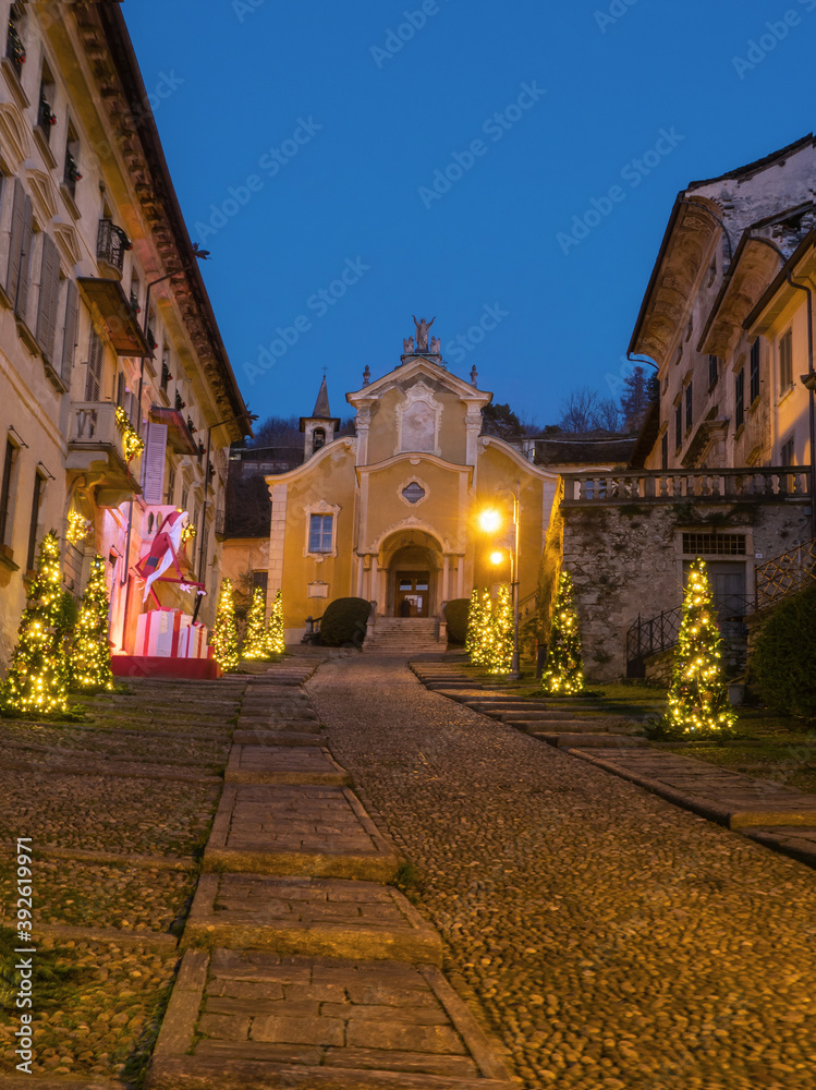 Christmas atmosphere in the medieval cobbled streets in Orta San Giulio, stunning medieval village in Piedmont.Italy