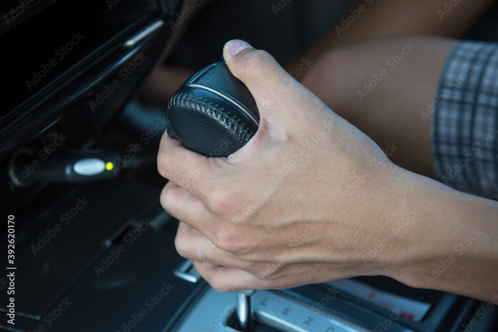 Driver hand shifting the gear stick