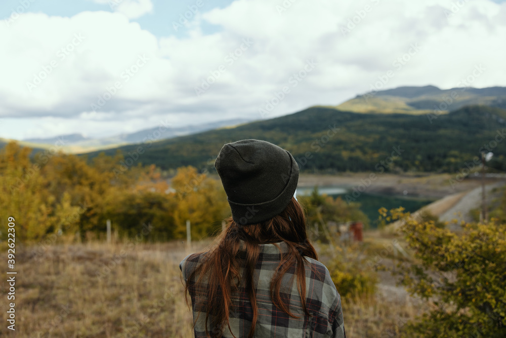 Woman on a meadow in the mountains dry grass nature fresh air