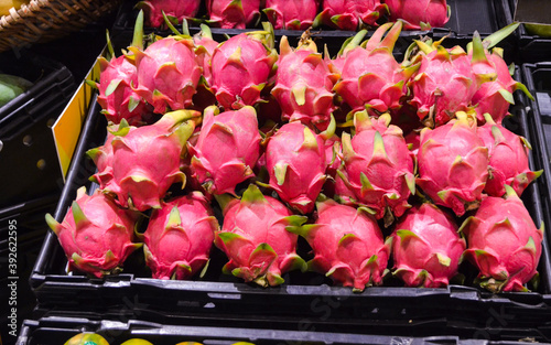 Group of dragon fruit or pitaya fruit in basket at super market