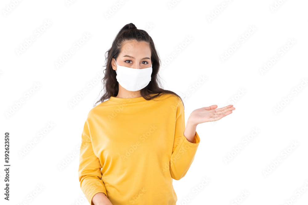 Young happy Asian woman pointing finger hands up to copy space wearing hygienic mask to prevent infection corona virus shoot in isolated on white background Young happy Asian woman pointing finger hands up to copy space wearing hygienic mask to prevent infection corona virus shoot in isolated on white background