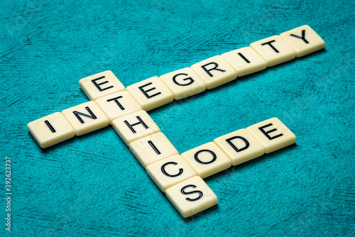 Bild auf Leinwand integrity, ethics and code crossword in ivory letters against textured handmade