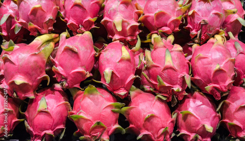 Group of dragon fruit or pitaya fruit in basket at super market