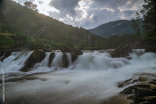 Strong and wide waterfall at the Fossestien